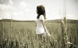 Girl alone in cornfield wallpaper